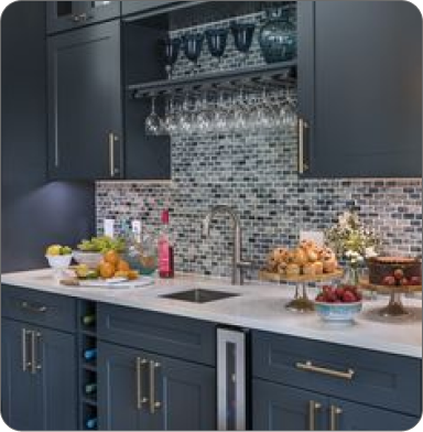 Comfortable office with plants, wooden desk, and two black chairs